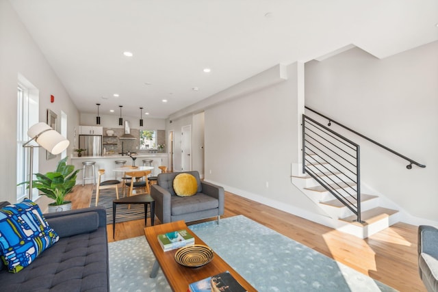 living room with light hardwood / wood-style flooring