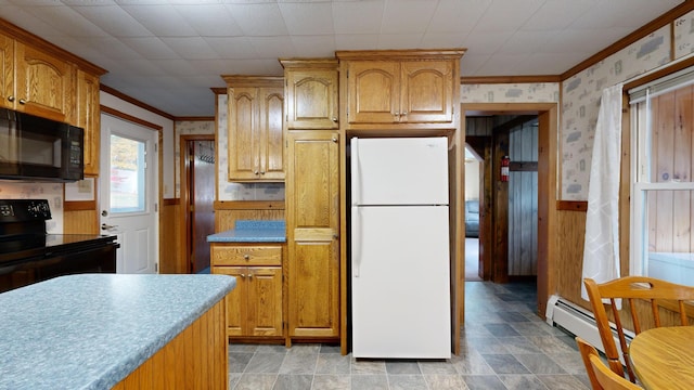 kitchen featuring black appliances, a baseboard radiator, and ornamental molding