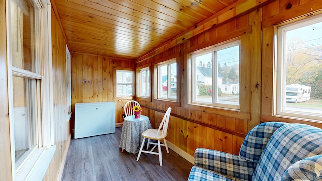 sunroom with wood ceiling and a wealth of natural light