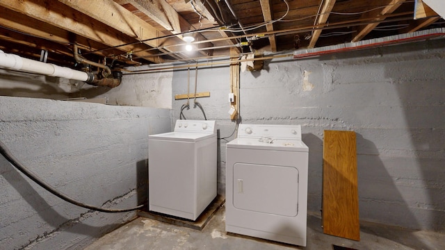 washroom featuring washing machine and dryer