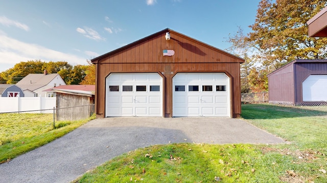 garage with a lawn