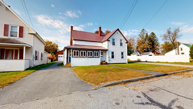 view of front property with a garage and a front lawn