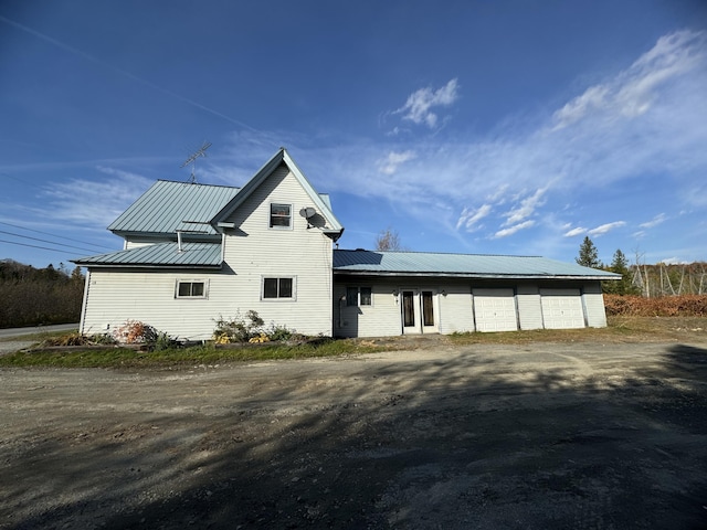 exterior space featuring a garage and solar panels