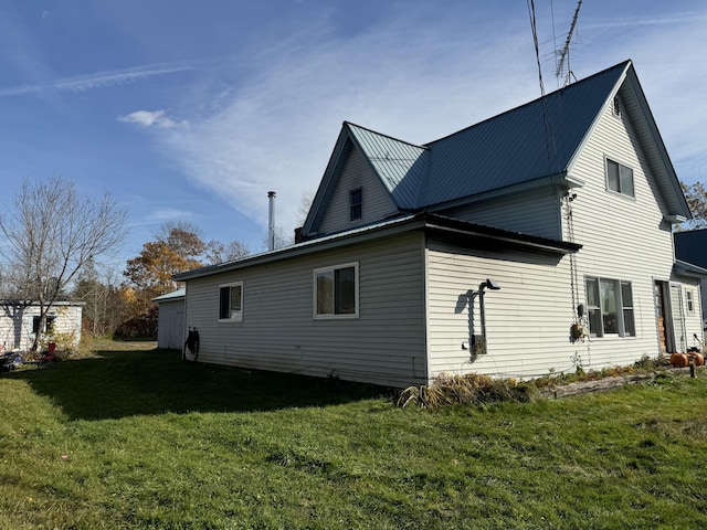 view of home's exterior featuring a yard