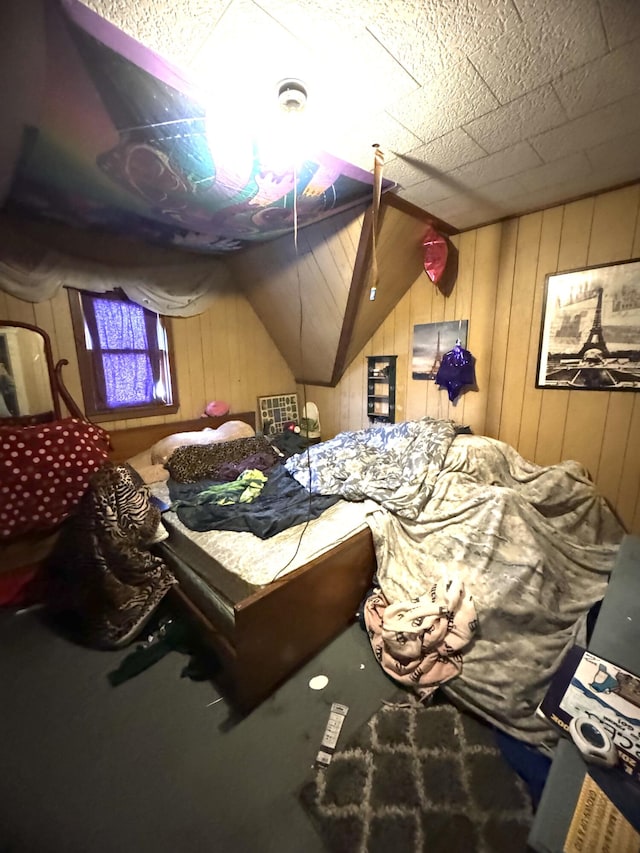 bedroom featuring wooden walls