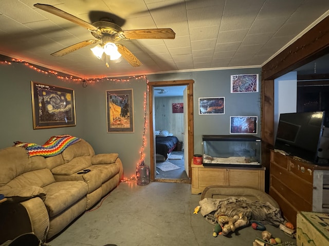 living room featuring crown molding and ceiling fan