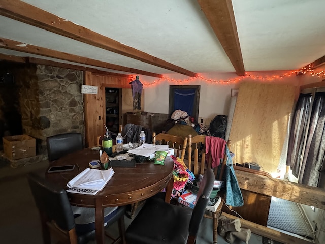 dining room with beamed ceiling