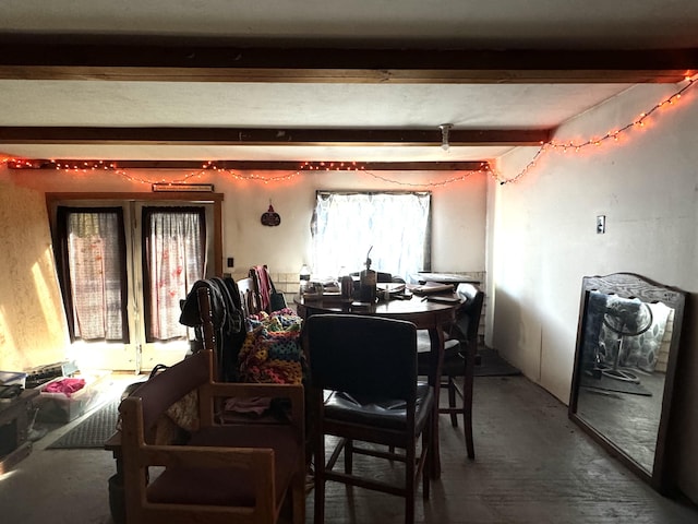 dining room with beamed ceiling