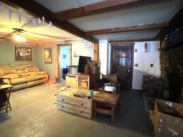 living room with ceiling fan and beam ceiling