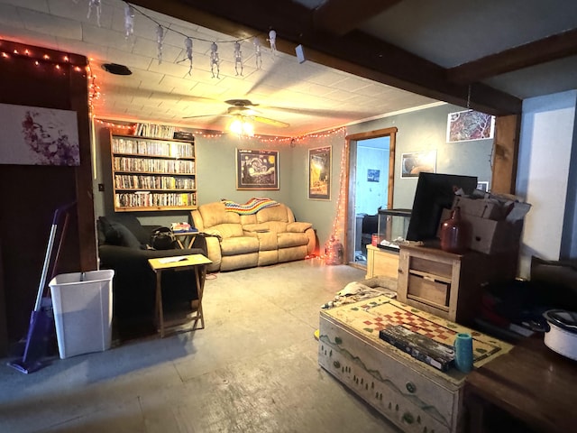 living room featuring ceiling fan and beamed ceiling