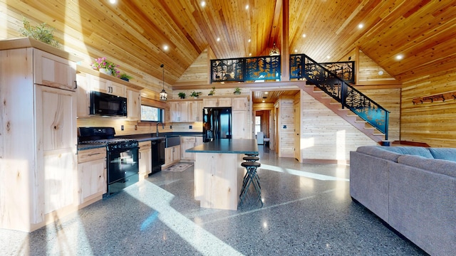 kitchen featuring a center island, wood walls, high vaulted ceiling, black appliances, and wood ceiling