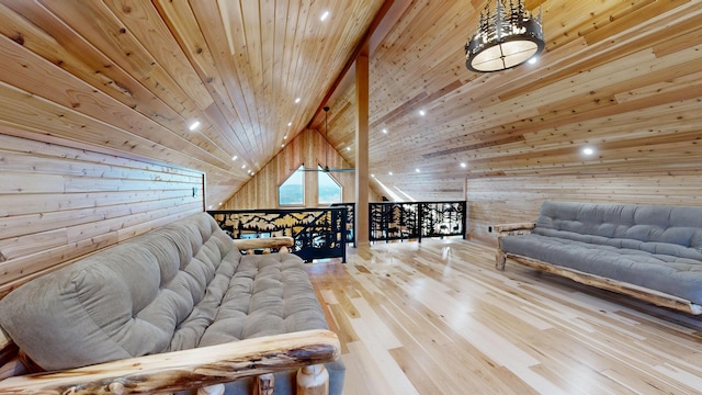 living room featuring wood-type flooring, wooden walls, high vaulted ceiling, and wooden ceiling