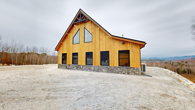 view of property exterior with an outdoor structure