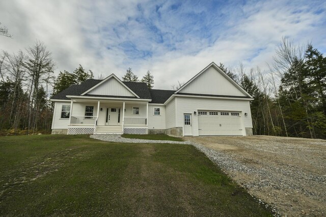 LOT8 Ward Rd, Sebago, ME 04029 - view of front facade with a porch, driveway, a garage, and a front lawn