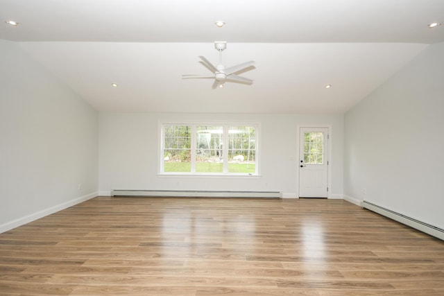 LOT8 Ward Rd, Sebago, ME 04029 - unfurnished living room featuring vaulted ceiling, baseboard heating, a ceiling fan, light wood-type flooring, and recessed lighting