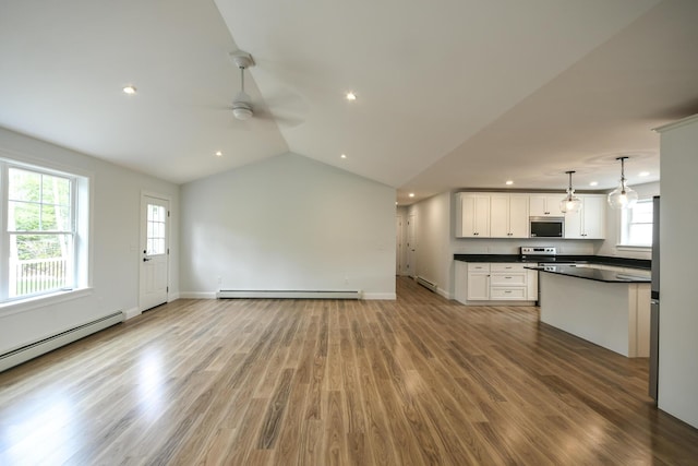 LOT8 Ward Rd, Sebago, ME 04029 - unfurnished living room with ceiling fan, recessed lighting, wood finished floors, baseboard heating, and vaulted ceiling