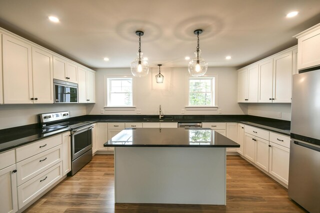 LOT8 Ward Rd, Sebago, ME 04029 - kitchen with stainless steel appliances, healthy amount of natural light, dark countertops, a kitchen island, and recessed lighting