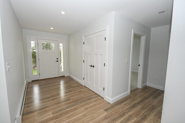 LOT8 Ward Rd, Sebago, ME 04029 - foyer with baseboard heating, light wood-style flooring, baseboards, and recessed lighting