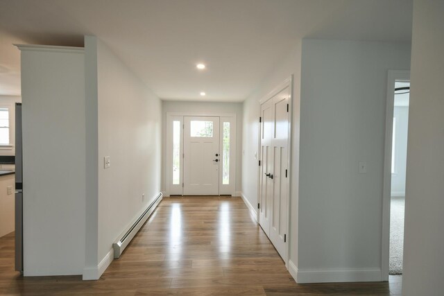 LOT8 Ward Rd, Sebago, ME 04029 - foyer entrance with baseboard heating, wood finished floors, baseboards, and recessed lighting