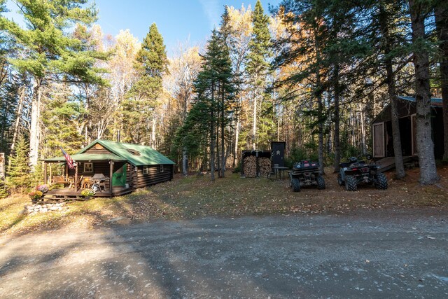 449 Porter Nadeau Rd, Eustis, ME 04936 - view of yard with a deck and a wooded view