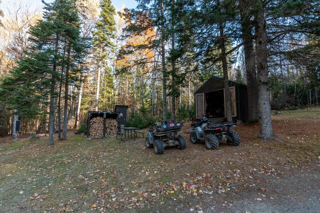 449 Porter Nadeau Rd, Eustis, ME 04936 - view of yard featuring an outbuilding and a detached garage