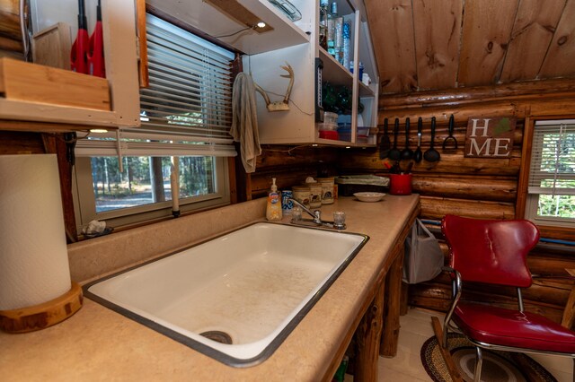 449 Porter Nadeau Rd, Eustis, ME 04936 - kitchen with rustic walls, wooden ceiling, and a sink
