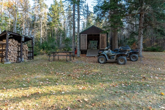 449 Porter Nadeau Rd, Eustis, ME 04936 - view of grassy yard with a pole building and an outdoor structure