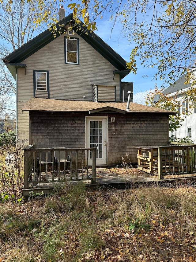 back of property featuring a deck