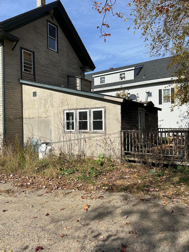 view of side of home featuring a deck