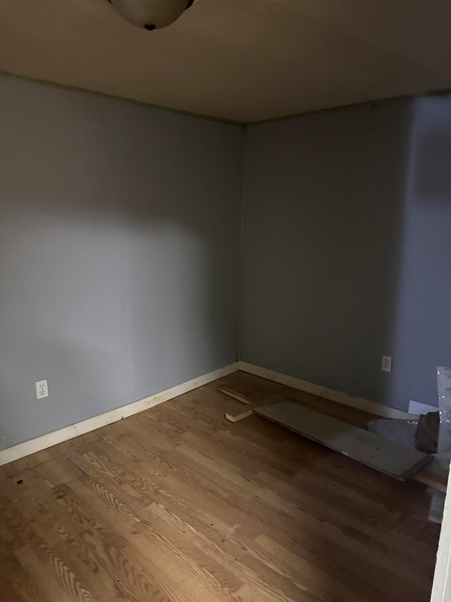 empty room with hardwood / wood-style floors