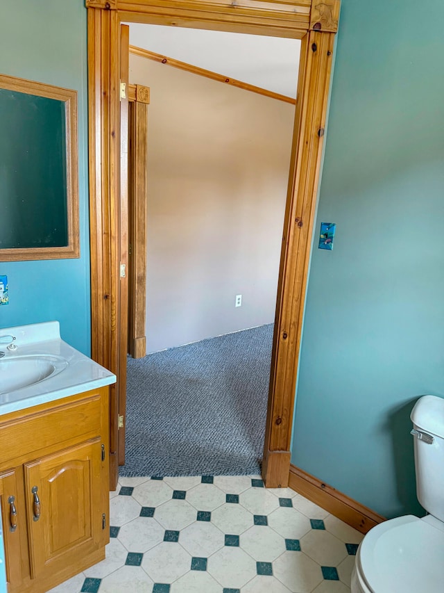 bathroom with toilet and vanity