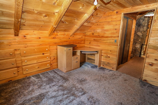 bonus room with wood ceiling, lofted ceiling with beams, wood walls, and carpet flooring