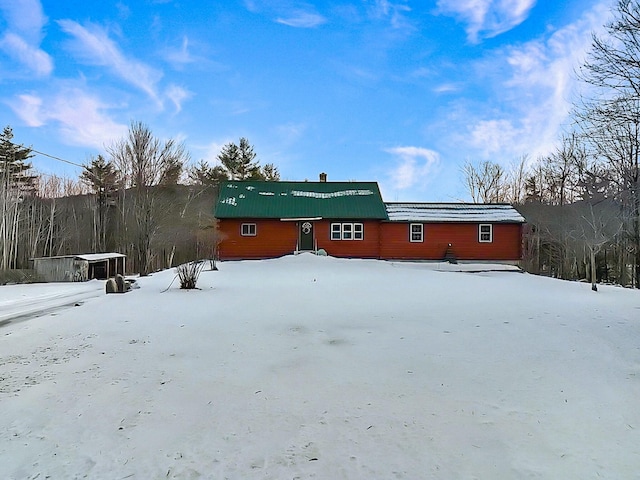 view of snow covered house