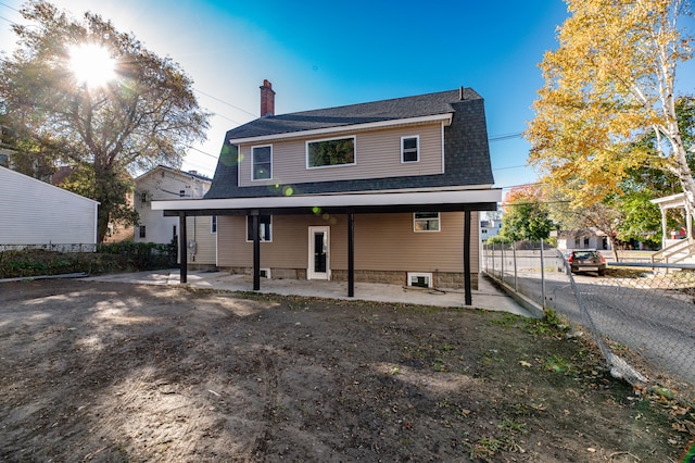 rear view of property featuring a patio area