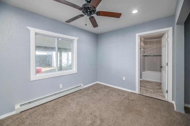 unfurnished bedroom featuring carpet floors, connected bathroom, a baseboard radiator, and ceiling fan