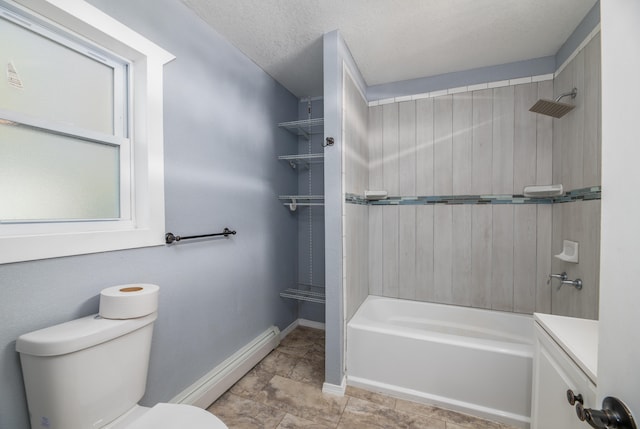 full bathroom with toilet, baseboard heating, tiled shower / bath, vanity, and a textured ceiling