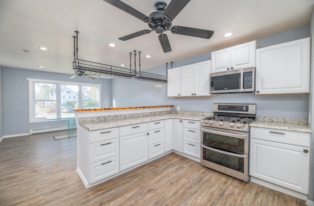 kitchen with white cabinetry, appliances with stainless steel finishes, and light wood-type flooring