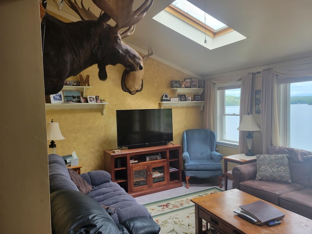900 Brewer Lake Rd, Orrington, ME 04474 - living area with a skylight, vaulted ceiling, plenty of natural light, and crown molding