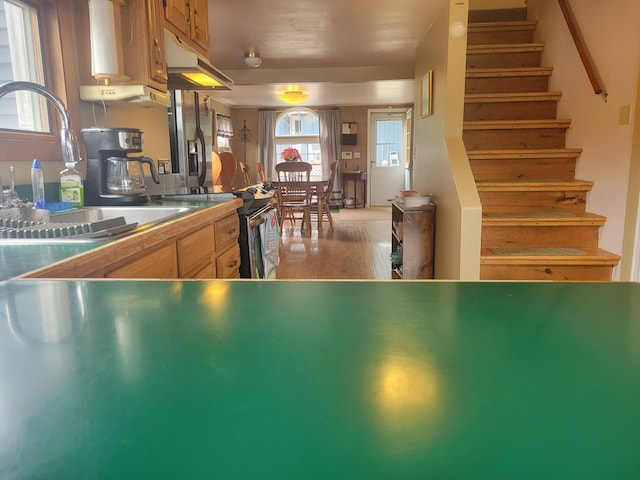 900 Brewer Lake Rd, Orrington, ME 04474 - kitchen featuring a sink and light wood-style flooring