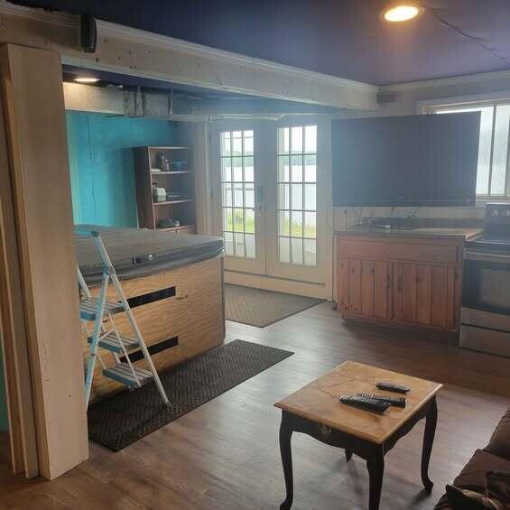 900 Brewer Lake Rd, Orrington, ME 04474 - living area with wood finished floors and recessed lighting