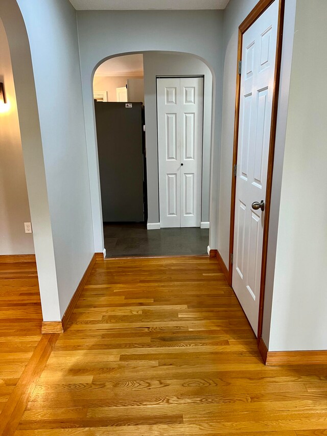 corridor with light wood-type flooring