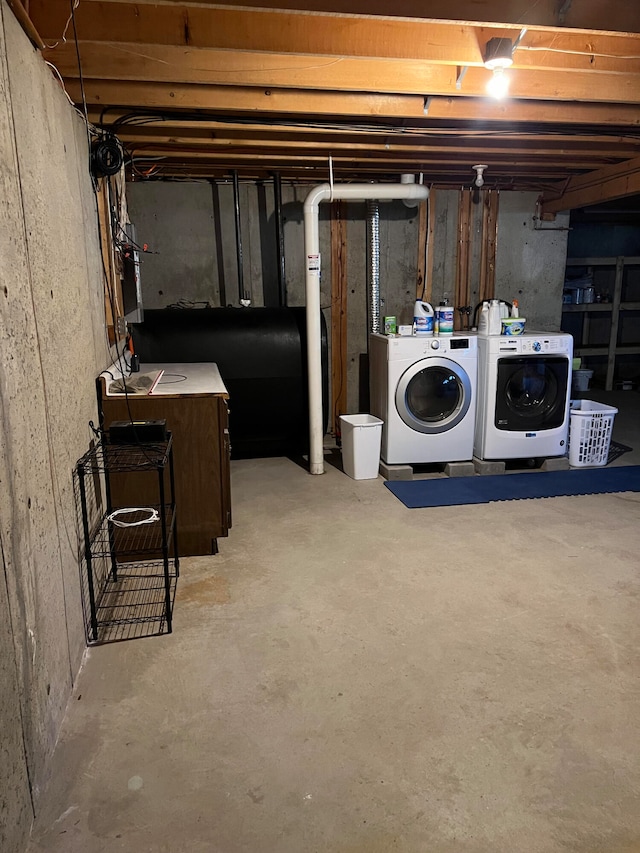 basement featuring washing machine and clothes dryer