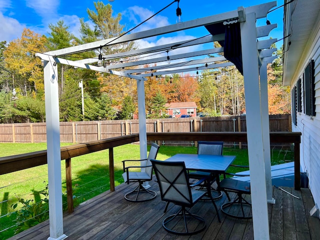 wooden terrace featuring a lawn and a pergola