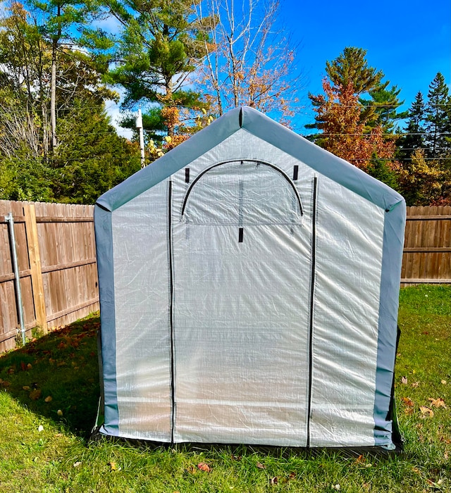 view of outbuilding featuring a yard