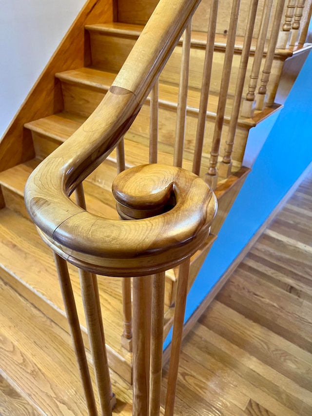 staircase featuring hardwood / wood-style flooring