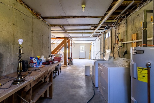 basement featuring water heater and washing machine and clothes dryer