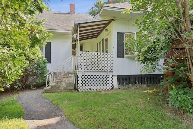 442-448 Maine Ave, Farmingdale, ME 04344 - entrance to property featuring roof with shingles, a lawn, and a chimney