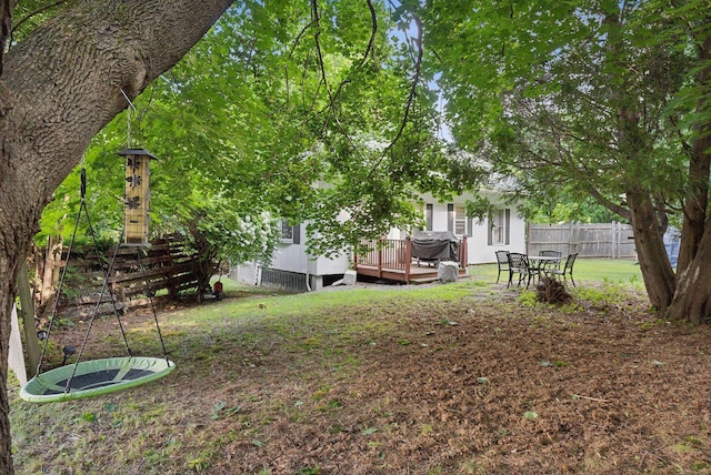 view of yard with a deck