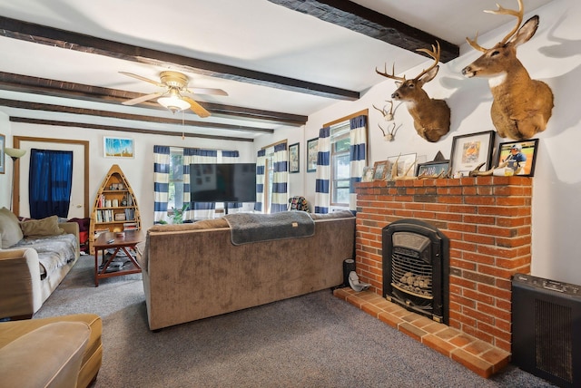 442-448 Maine Ave, Farmingdale, ME 04344 - carpeted living room with a brick fireplace, a ceiling fan, and beamed ceiling