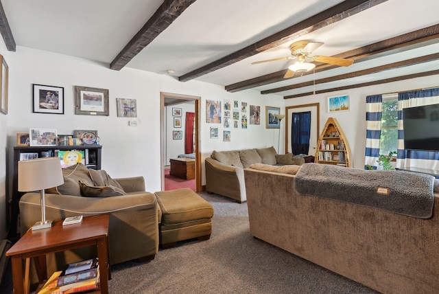 living room featuring beam ceiling, carpet, and ceiling fan